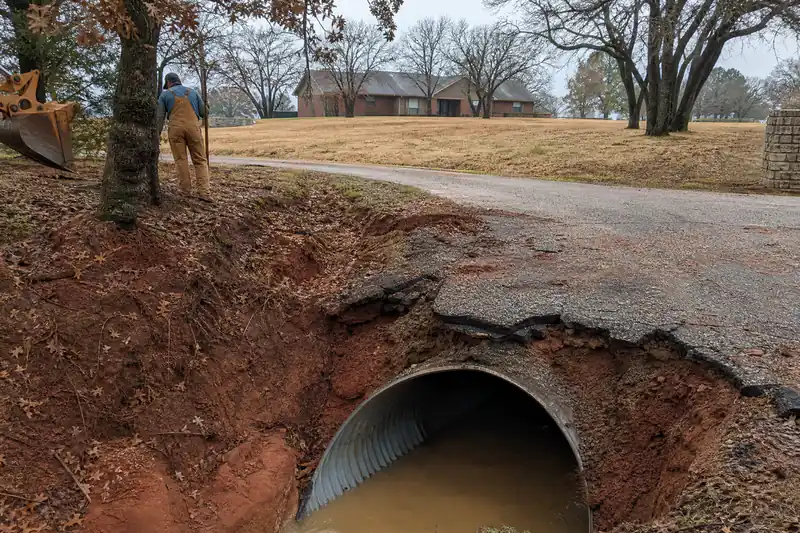 Acreage driveway crossing a culvert over a roadside ditch in Choctaw, Oklahoma