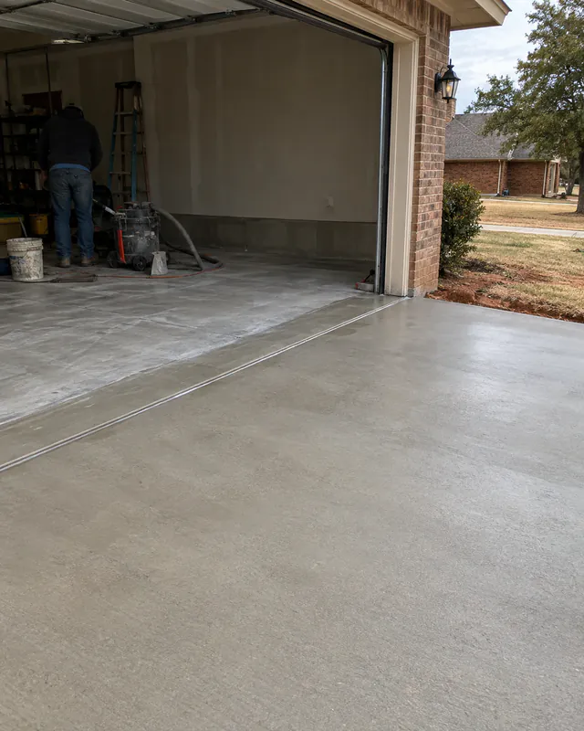 Driveway flush with the garage slab after repair in Oklahoma City